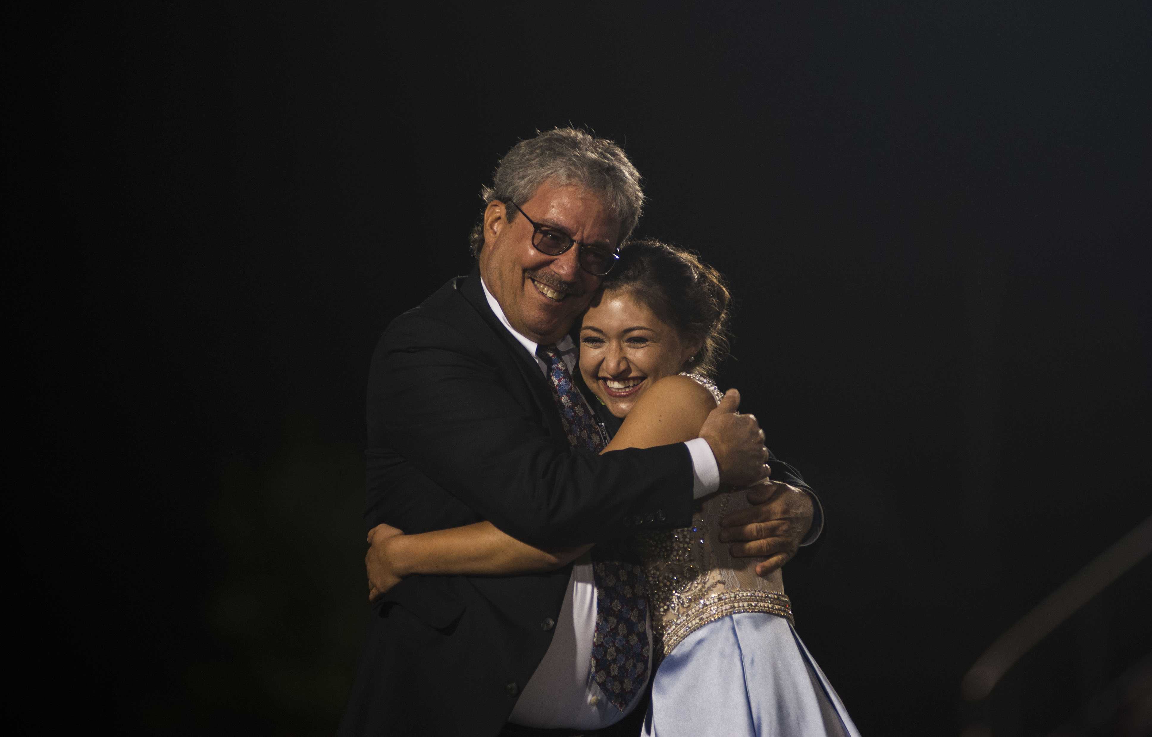 Tavin Cook hugs her father after being announced as Homecoming Queen at Friday's homecoming football game.