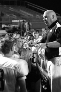 Coach Barnett talks to his players after a game.