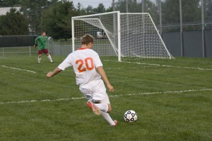 Senior Sam Mccrillis launches a shot from just outside the 18 box. Mccrillis had two goals in the Cougars victory.