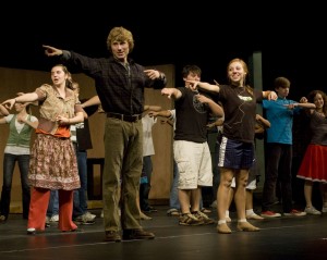 Senior Andrew Shaw and Junior Hailey Esch, along with the rest of the Paint Your Wagon cast, dance on stage during rehersal on Oct 24.