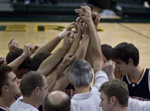 The Boy's Varsity Basketball get in a huddle before the game on Feb. 2 against South at South.  We ended up winning the game with a score of 57-27.  They are now 7-2 in thier basketball season.