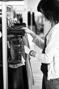 Junior Haylee Slocum looks through clothes at Ditto consignment store in Overland Park. “I just wear what I feel like. And whatever feels comfortable or looks cute that day. I don’t really have a set style,” Slocum said.