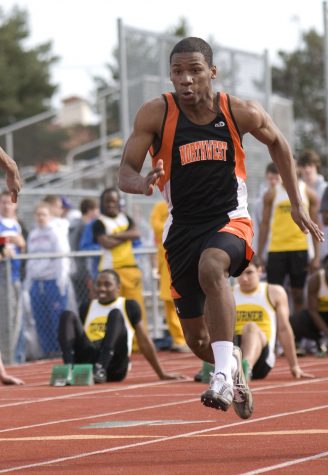 Sophomore Duan Johnson sprints during the 100-meter-dash at the SM South track meet on March 26.