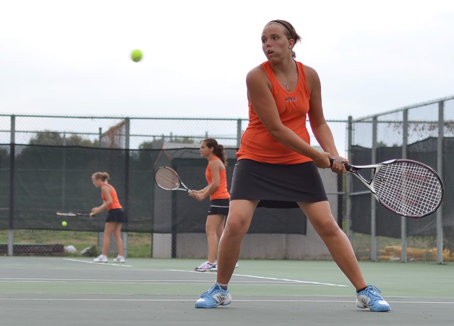 Junior Faith Bryant hits the ball to her Lawrence opponent on Sept. 17 at SMNW.