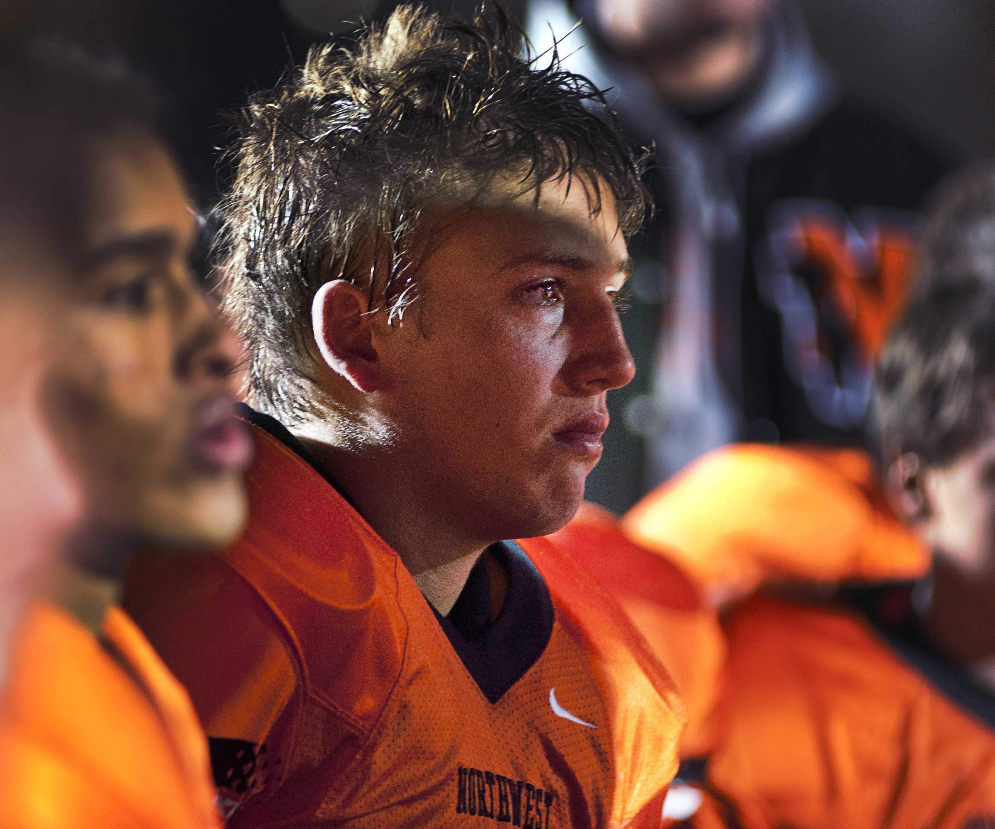 Senior Jorn Winkelmolen reacts to the loss of Northwest's last football game of the year on Oct. 26 at SM North. The cougars lost 40-9 with a final record of 2-7. "I was very sad because I knew I was done playing football forever," Winkelmolen said. "And that really hit me hard after the last game."