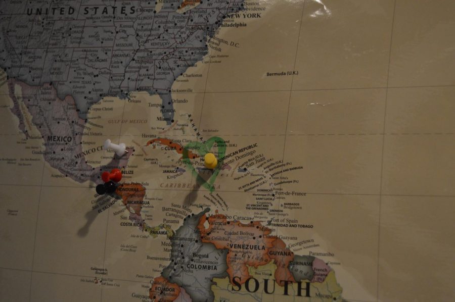 On one wall of Wood's bedroom hangs a world map with pins placed in the countries she has visited, and a heart surrounding Haiti.
