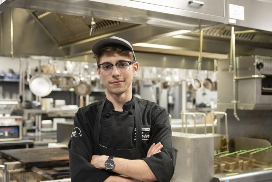 At his station, Reis Miller poses in the Broadmoor Bistro’s kitchen Sep. 9. Miller has won multiple national cooking awards in first place winner of the Culinary Arts competition.