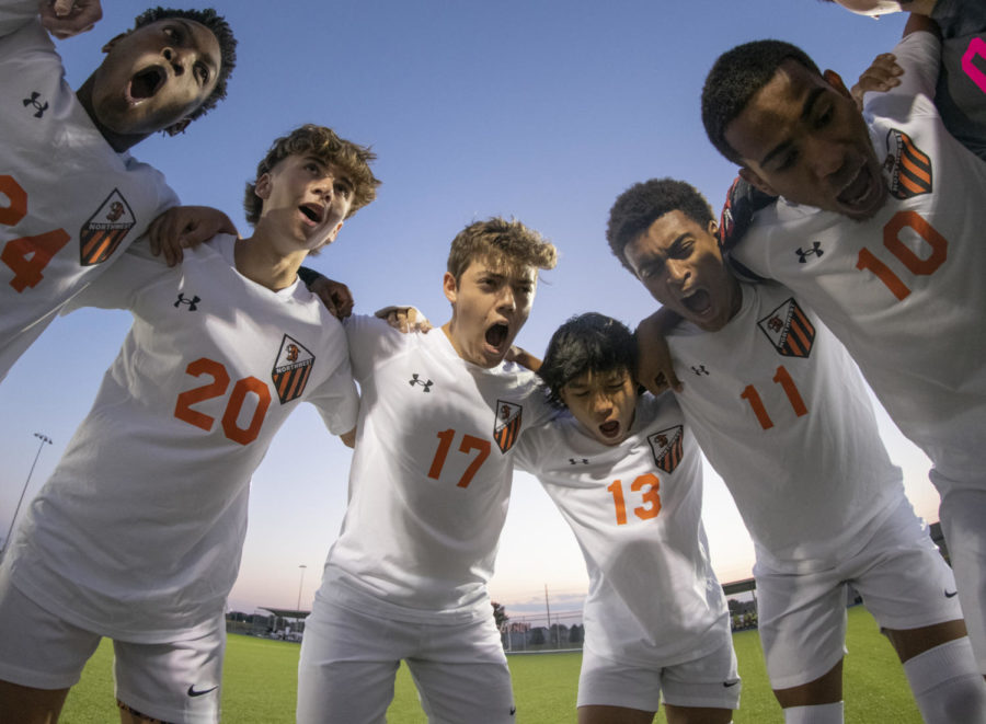 During the team’s pre-game huddle, sophomore Omarion Dilunga, junior Brooks Borgman, senior Jack Groebe, junior Caleb Munshayakham, junior Lucas Taitt and senior Nestor Reyes shout Oct. 13 at Gardner Edgerton High School. While the Cougars were huddled, they performed their “Boom Boom” chant before the match. “The pre-game huddle gets us locked in and focused for the game,” Groebe said. “Our chant has been a tradition for years and gets us pumped up to go out and win the game.” 