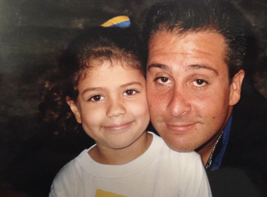 Math teacher Tatiana Briceno smiles with her father. When she was young, her father was shot in the leg in Venezuela.