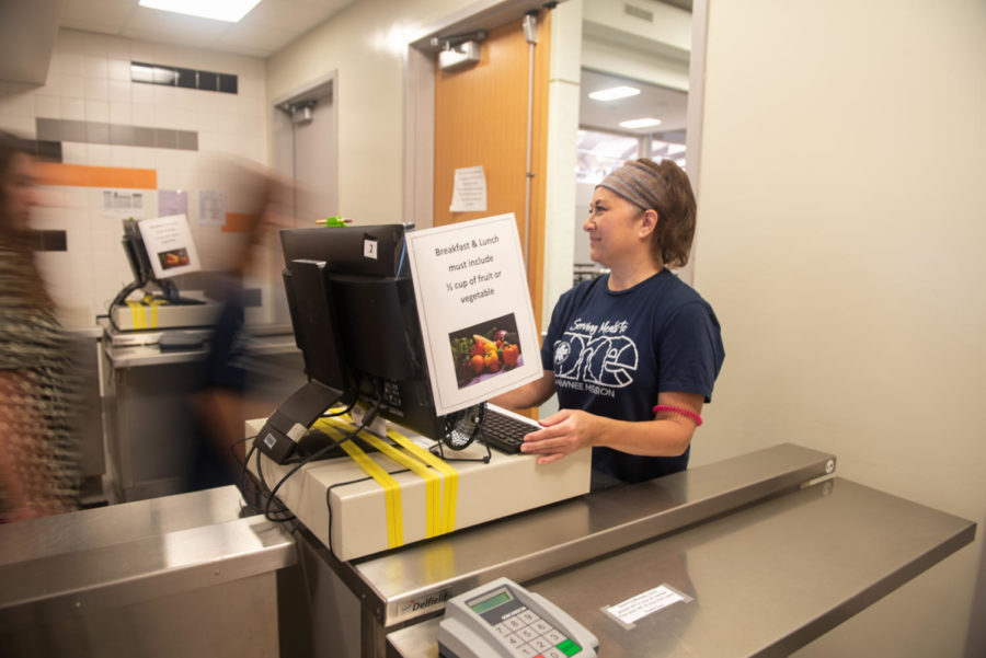 As+the+only+cashier+in+this+lunch+line%2C+Judy+Maxon+works+to+check+students+out+as+quickly+as+possible..+The+food+services+staff+has+been+experiencing+a+shortage+of+workers+since+students+returned+to+the+building+during+the+pandemic.++%E2%80%9CSome+days+it%E2%80%99s+a+little+more+challenging+getting+started+in+the+mornings+or+getting+lunch+on+time%2C%E2%80%9D+Maxon+said.+%E2%80%9CWe%E2%80%99re+working+as+fast+as+we+can+go%2C+%5Bbut+we%E2%80%99re%5D+short-handed.%E2%80%9D