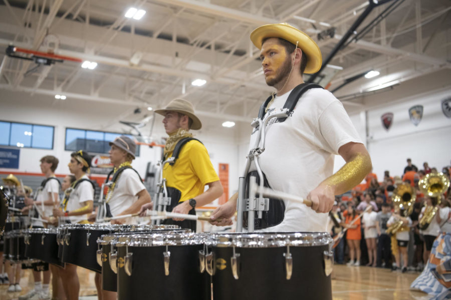 Senior+Tanner+Pruter+plays+the+tenor+drum+Aug.+31+in+Main+Gym.+The+Marching+Cougar+Pride+performed+their+%E2%80%9CChaos+Order%E2%80%9D+show+during+the+Bonfire+Assembly.+%5BDuring+the+performance%5D+the+band+is+split+between+chaos+and+order%2C%E2%80%9D+Pruter+said.+%E2%80%9CThe+beginning+of+the+show+starts+out+with+chaos+and+throughout+the+show%2C+you+get+little+glimpses+of+order.%E2%80%9D