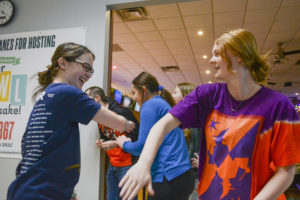 High-fiving each other, seniors Melaina Hesterlee and Piper Denning celebrate Hesterlee’s strike during a bowling practice Jan. 9 at Park Lanes. Bowlers often congratulate each other when they get strikes or spares. “Whenever we get a strike that’s very good, and we congratulate each other,” Denning said. “When you high-five someone they will high-five you back, and you just feel good about yourself.”