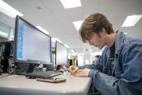 Senior Xavier Williamson compiles resources for a manufacturing project Jan. 20.  Williamson is enrolled in Engineering Design & Development course. “The CAA has been a very good experience for real world application,” Williams said. 