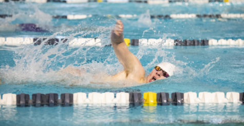 Senior Kyle Vogel comes up for air Jan. 7 at SM Aquatic Center. Vogel placed 3rd in the boys 200 meter Freestyle with a time of 36.05. “[During a race] I try to keep my form as good as I can while also keeping up my arm tempo,” Vogel said. “I thrive off of improvement and I love looking at the board after a race and seeing a new best time.” 