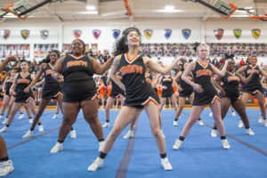 During the Sweetheart Assembly, senior Cynthia Chen performs her cheer routine Feb. 3 in the Main Gym. Every routine beings with a cheer and ends with a dance. “Dancing has always been a crucial part of cheer,” Chen said. “It demonstrates the musicality and athleticism of a cheerleader, it also makes the overall routine more enjoyable to watch and helps move the crowd more than just cheer and stunts.”