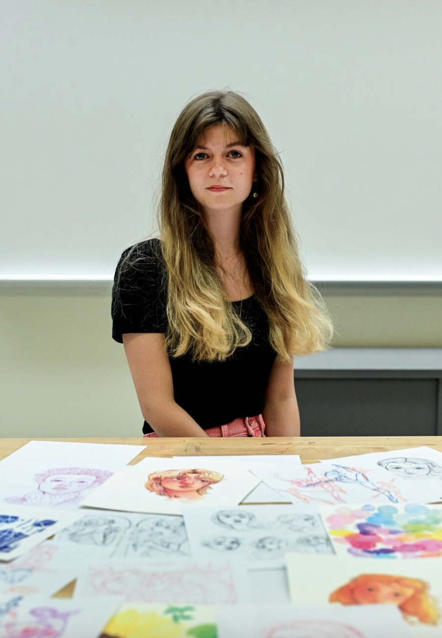 Sophomore Grace Rau sits in front of her unfinished work July 27 in Room 7.