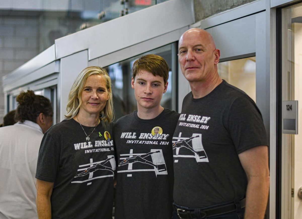 Will Ensleys family poses for a photo Jan. 6 at the shawnee mission Aquatic Center. Photo by Cooper Evans