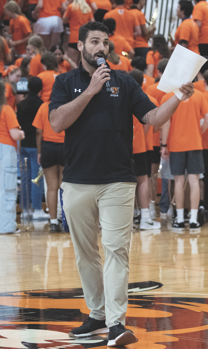 New Athletic Director Heath Wilson gives his first speech Aug. 18 in the Main Gym. Wilson had never run an assembly before. “I think I was nervous for sure,” Wilson said. “It's not even just talking in front of people. You know, it's just that you're trying to manage 2500 people and you're always going to have nerves.”
