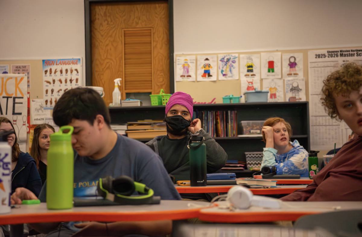 Watching intently, special education students listen in on a lesson about building connections Dec. 4, 2025. 