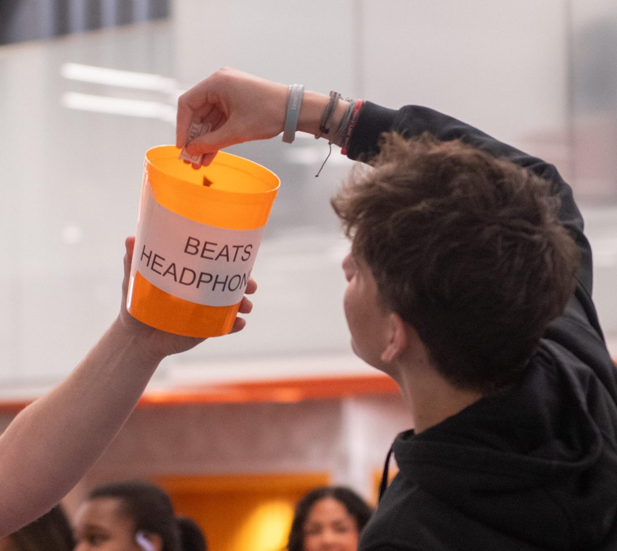 Senior Luke Chalfie draws student names from the attendance raffle for Beats headphones on March 6, 2026. 